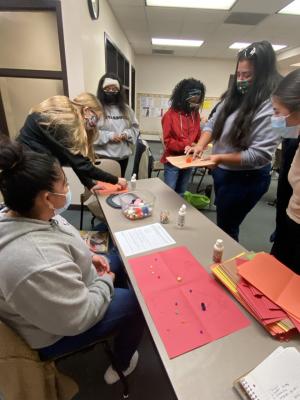 Practicum students demonstrating math activity 